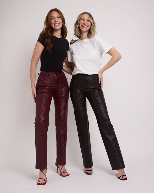 Tall girls wearing leather trousers