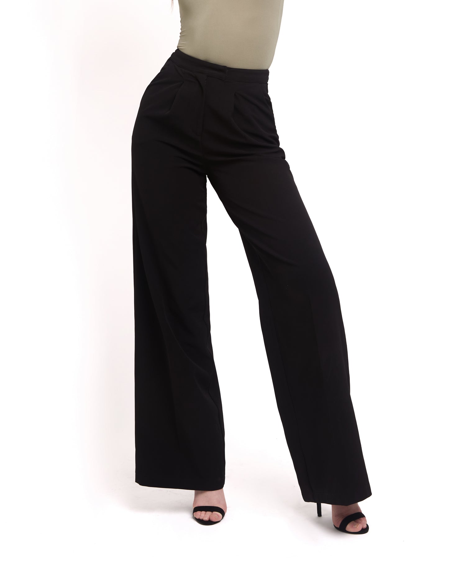 A model wearing tall wide leg tailored trousers in black with a high-waisted fit and a sleek silhouette.