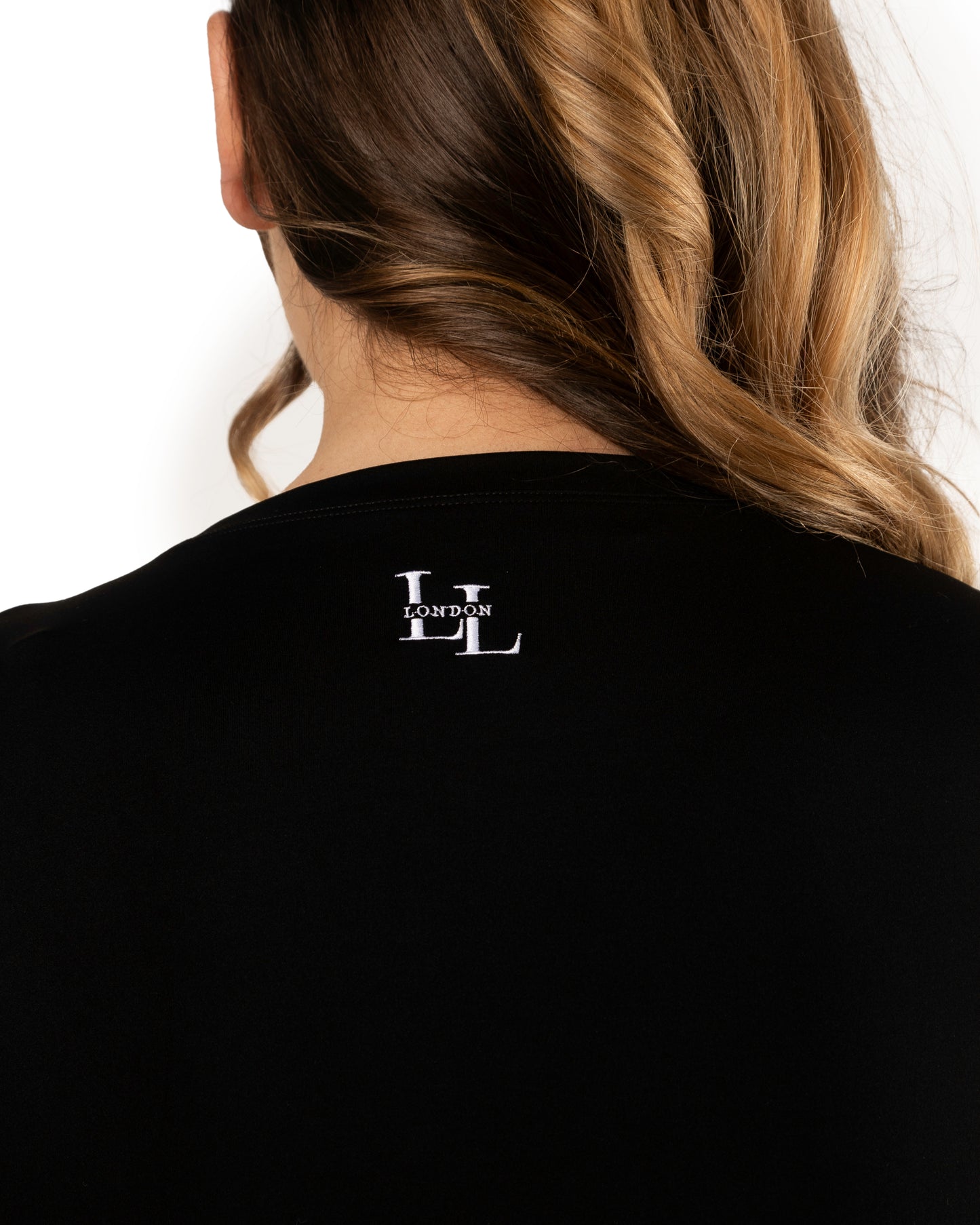 back detail of long legs London logo stitched in white on short sleeve black top