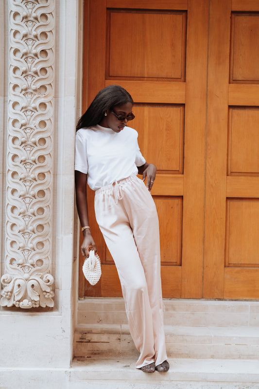 Tall girl in satin trousers
