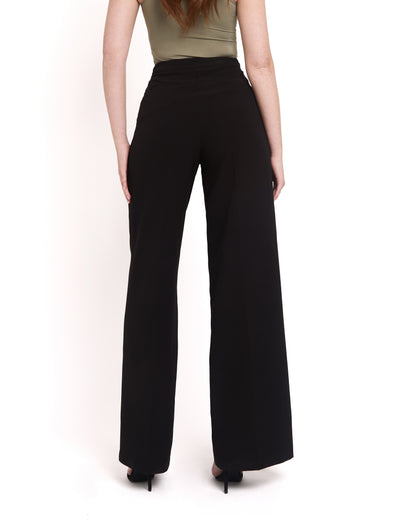A model wearing tall wide leg tailored trousers in black with a high-waisted fit and a sleek silhouette. Back shot with two accessible back pockets 
