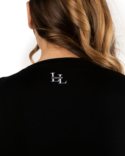 back detail of long legs London logo stitched in white on short sleeve black top 